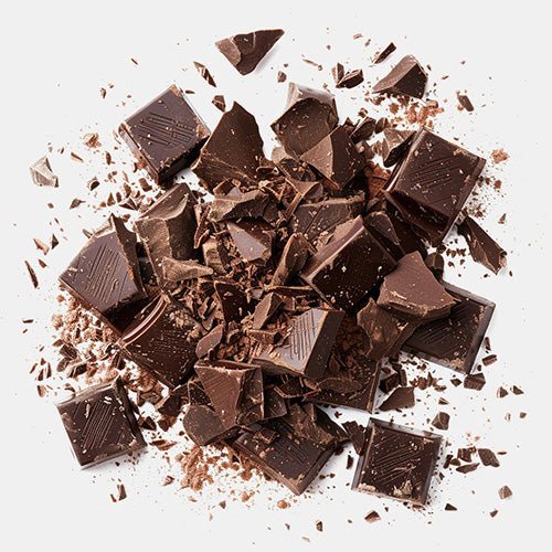 Chunks of chocolate broken lying in a pile (artistic)