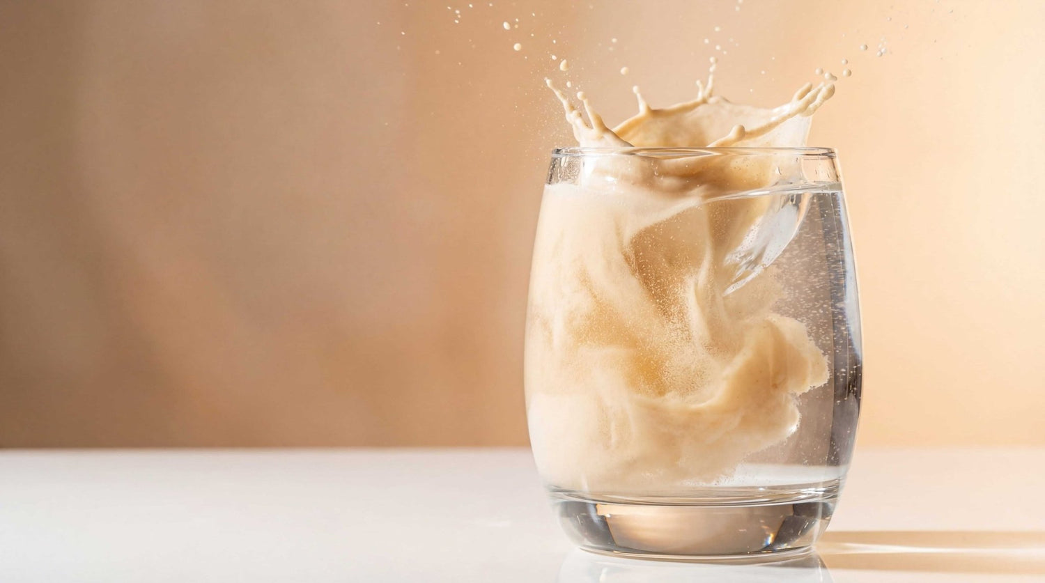 High-speed capture of protein shake (RISE311 vanilla protein) splashing in glass