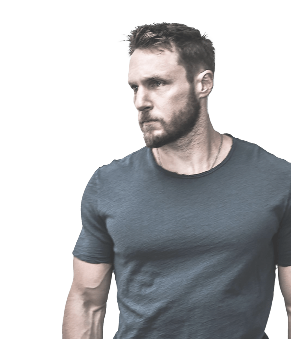 RISE311 co-founder Jason Walsh wearing gray t-shirt looking off to the side.