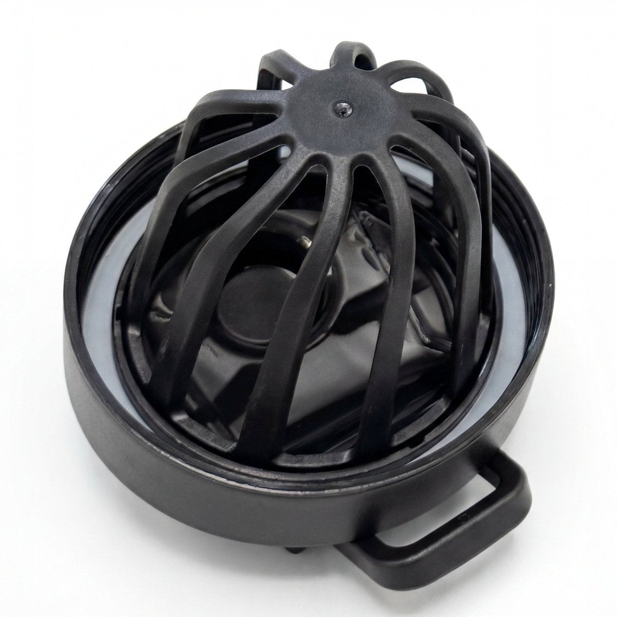 Black metal shaker cup lid and built-in agitator mechanism top view